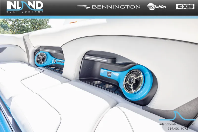 Slide: The Image of Interior of a 2016 Centurion Ri237 boat with blue speakers. - 20