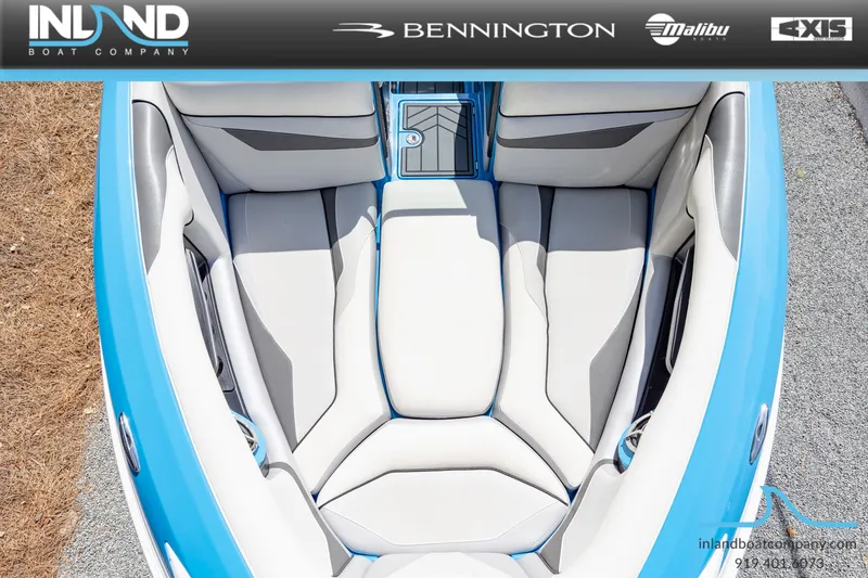 Slide: The Image of Interior view of a 2016 Centurion Ri237 boat with blue and gray seating. - 21
