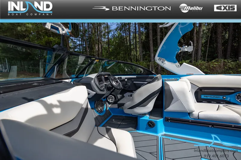 Slide: The Image of Interior of a 2016 Centurion Ri237 boat, blue and white upholstery. - 28