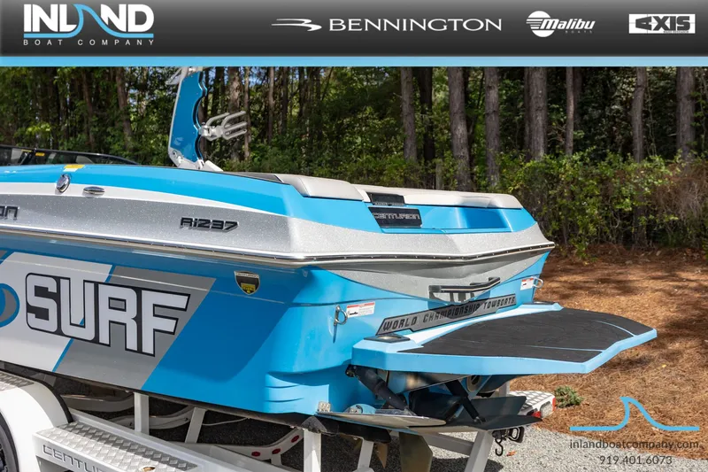 Slide: The Image of 2016 Centurion Ri237 boat with surf design, showcased by Inland Boat Company. - 8