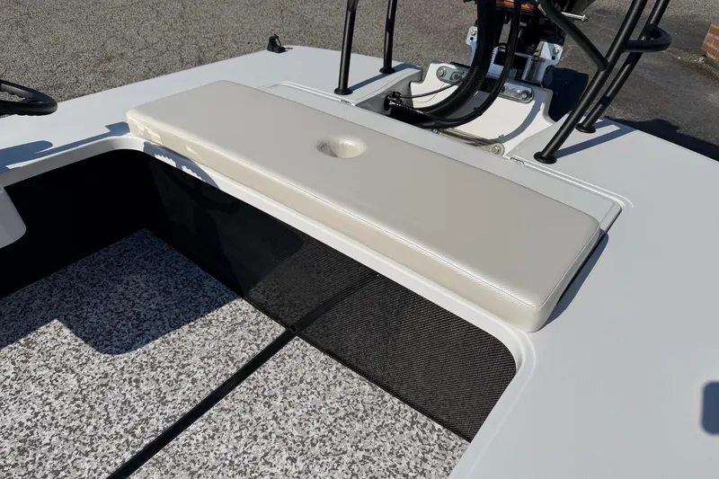 Slide: The Image of 2026 Chittum Skiffs 18 Challenger 2.0 Tunnel interior with cushioned seat and textured flooring. - 14