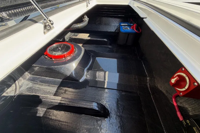 Slide: The Image of Interior view of 2026 Chittum Skiffs 18 Challenger 2.0 Tunnel, showcasing battery and wiring. - 15