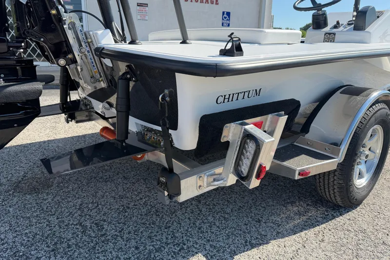 Slide: The Image of 2026 Chittum Skiffs 18 Challenger 2.0 Tunnel boat on trailer, rear view. - 18