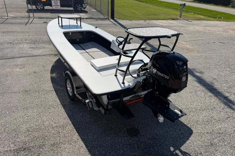 Slide: The Image of 2026 Chittum Skiffs 18 Challenger 2.0 Tunnel with Tohatsu engine on trailer. - 2