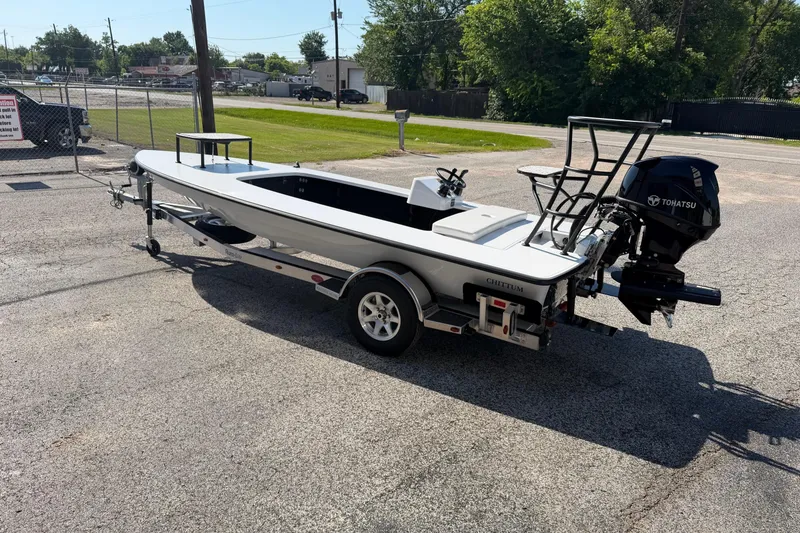 Slide: The Image of 2026 Chittum Skiffs 18 Challenger 2.0 Tunnel boat on trailer, parked outdoors. - 4