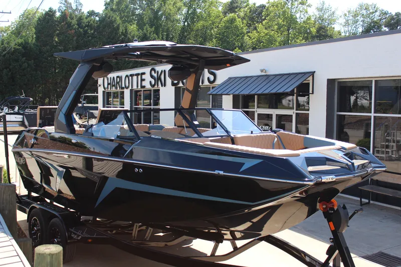 Slide: The Image of 2026 Tigé 22RZX boat displayed at Charlotte Ski Boats dealership. - 1