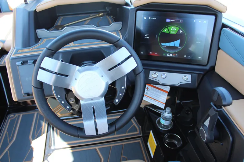 Slide: The Image of Steering wheel and dashboard of 2026 Tigé 22RZX boat with touchscreen display. - 12