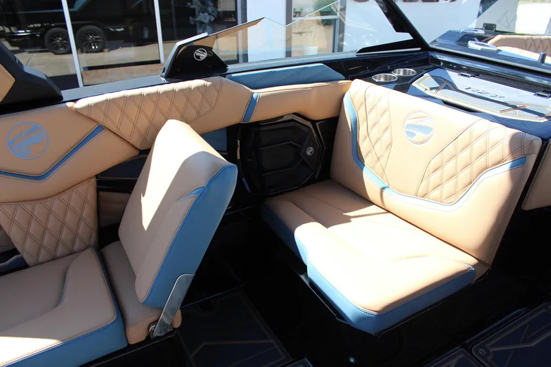 Slide: The Image of 2026 Tigé 22RZX boat interior with tan and blue leather seating. - 14