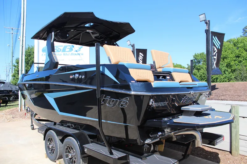 Slide: The Image of 2026 Tigé 22RZX boat on trailer, featuring sleek design and comfortable seating. - 4
