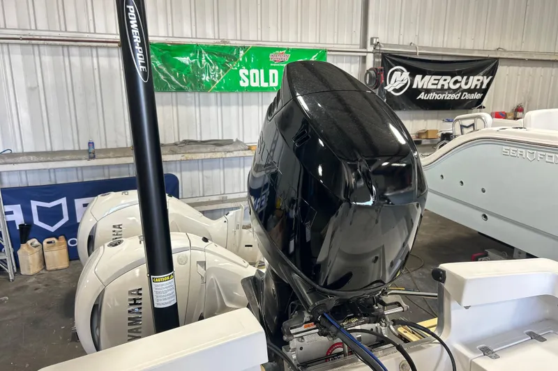 Slide: The Image of 2005 SeaCraft SC 23 Classic boat with Yamaha outboard engines in a dealership. - 13