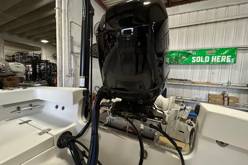 Slide: The Image of 2005 SeaCraft SC 23 Classic boat engine in a warehouse setting. - 16