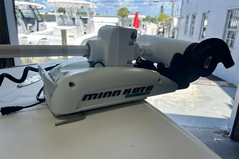 Slide: The Image of Minn Kota trolling motor on 2005 SeaCraft SC 23 Classic boat, docked outdoors. - 8