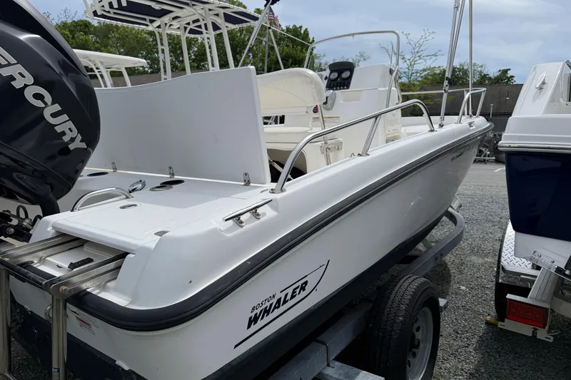 The Image of 2011 Boston Whaler 180 Dauntless boat with Mercury engine on trailer. - 0
