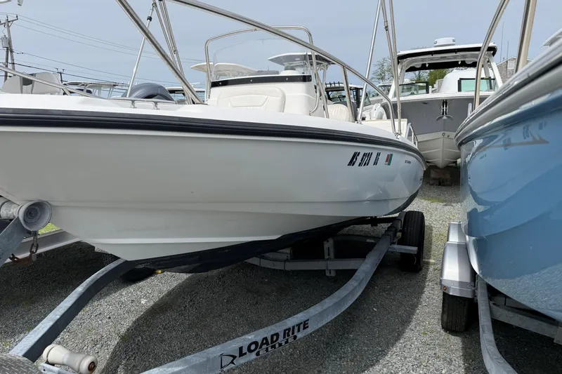 Slide: The Image of 2011 Boston Whaler 180 Dauntless boat on Load Rite trailer, parked outdoors. - 1