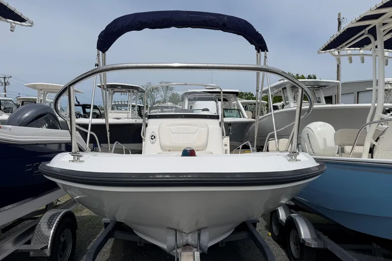 Slide: The Image of 2011 Boston Whaler 180 Dauntless boat on trailer, front view with canopy. - 4