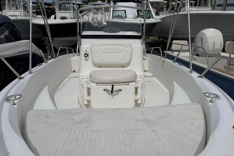 Slide: The Image of 2011 Boston Whaler 180 Dauntless boat interior with seating and console. - 5