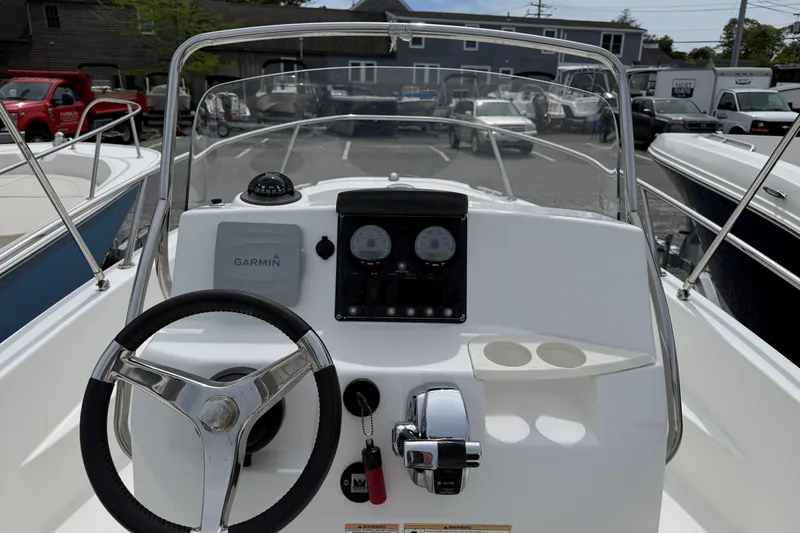 Slide: The Image of Boston Whaler 180 Dauntless 2011 boat dashboard with Garmin navigation system. - 9