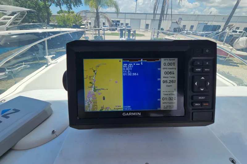 Slide: The Image of Garmin GPS on 1998 Bayliner 2503 Trophy Center Console, displaying navigation and depth data. - 18
