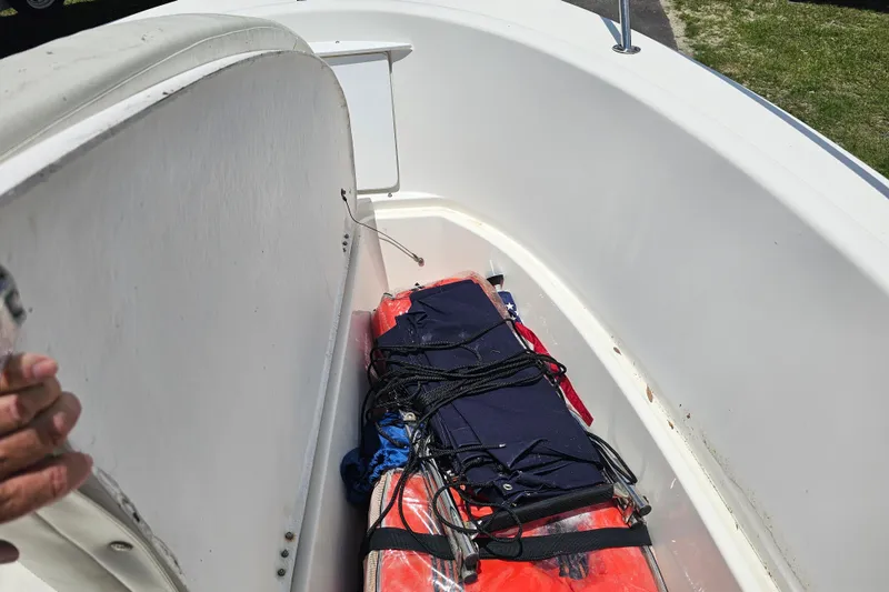Slide: The Image of 1998 Bayliner 2503 Trophy Center Console boat with life jackets and equipment stored onboard. - 20