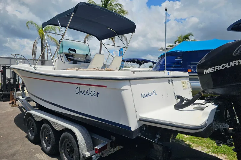 Slide: The Image of 1998 Bayliner 2503 Trophy Center Console boat on trailer, Naples FL. - 4
