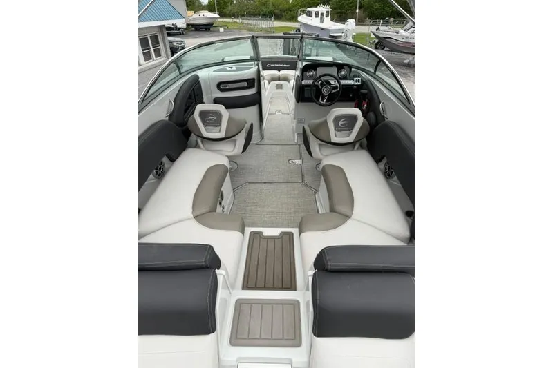 Slide: The Image of 2022 Crownline 265 SS boat interior with spacious seating and modern dashboard design. - 13
