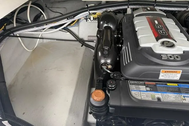 Slide: The Image of Engine compartment of a 2022 Crownline 265 SS boat, featuring a Mercury 6.2L engine. - 18
