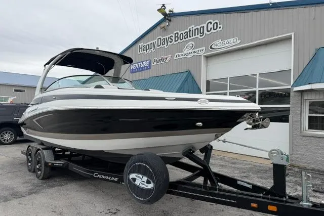 Slide: The Image of 2022 Crownline 265 SS boat on trailer at Happy Days Boating Co. dealership. - 2