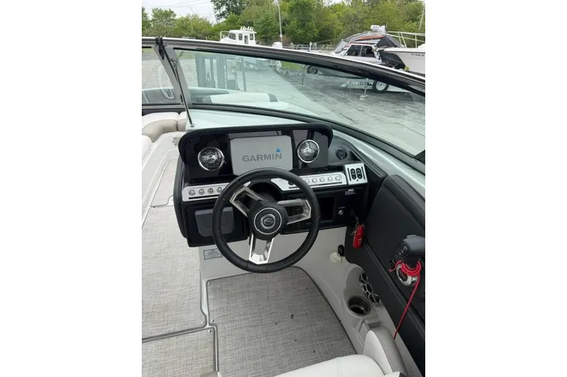 Slide: The Image of 2022 Crownline 265 SS boat dashboard with Garmin navigation system. - 6