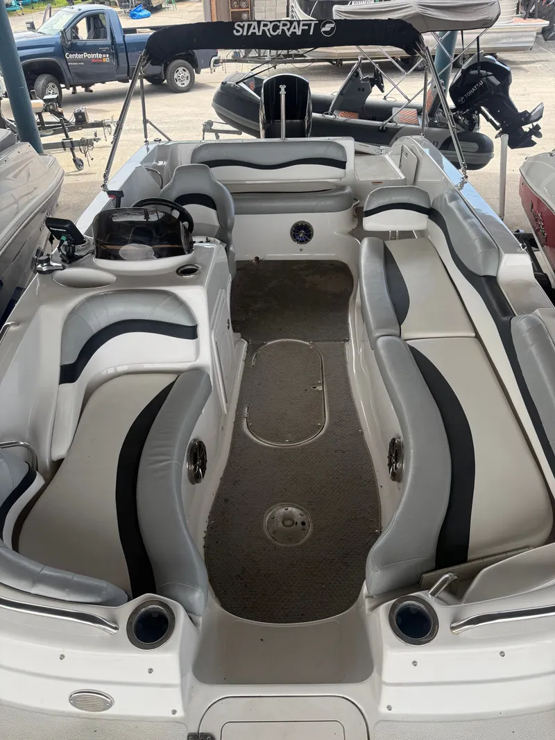 Slide: The Image of Interior view of a 2015 Starcraft 2000 IO Limited boat. - 3