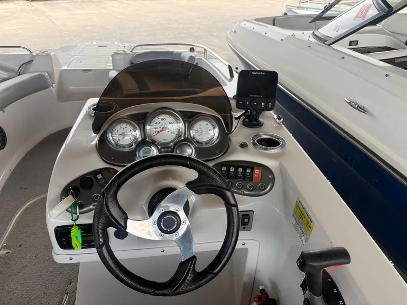 Slide: The Image of Dashboard of a 2015 Starcraft 2000 IO Limited boat. - 4