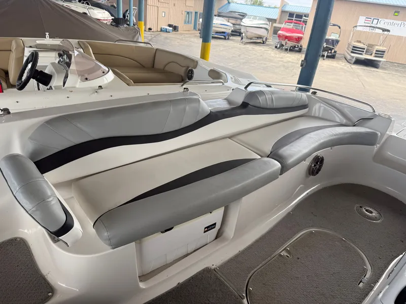 Slide: The Image of Interior of a 2015 Starcraft 2000 IO Limited boat with gray seating. - 8