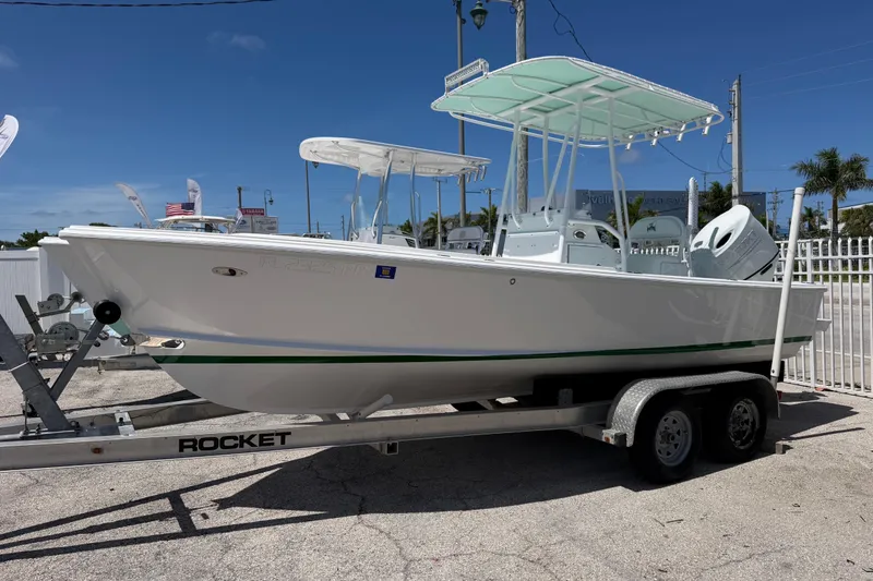 The Image of 2014 Albury Brothers 20 boat on trailer under clear blue sky. - 1