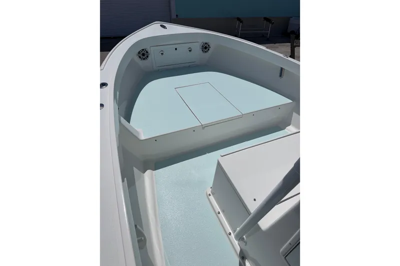 Slide: The Image of 2014 Albury Brothers 20 boat interior with light blue deck and storage compartments. - 4
