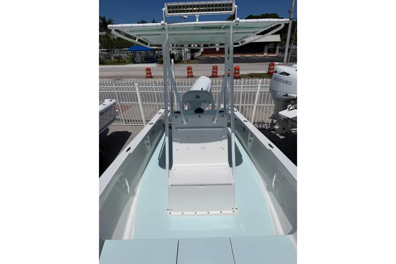 Slide: The Image of 2014 Albury Brothers 20 boat with T-top and center console, docked outdoors. - 5