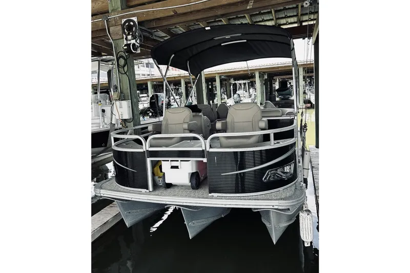 The Image of 2021 Avalon LSZ Rear Fish 22' pontoon boat docked under shelter. - 0