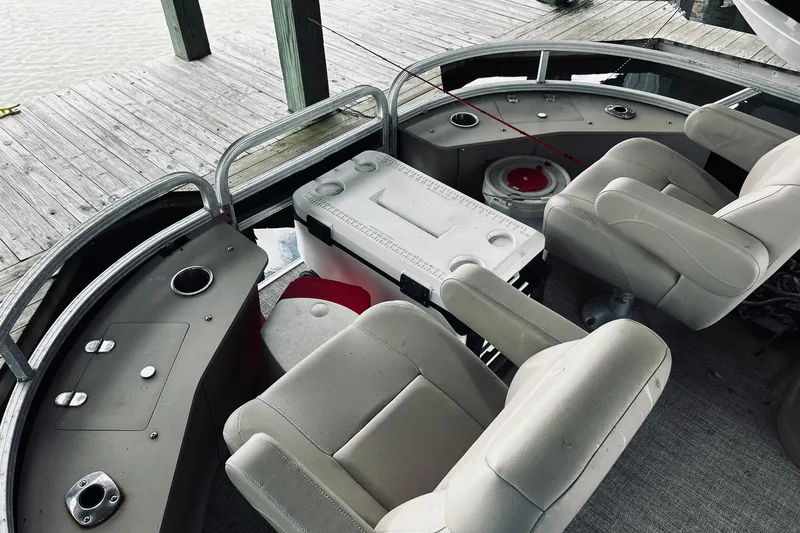 Slide: The Image of 2021 Avalon LSZ Rear Fish boat interior with seating and fishing setup. - 10