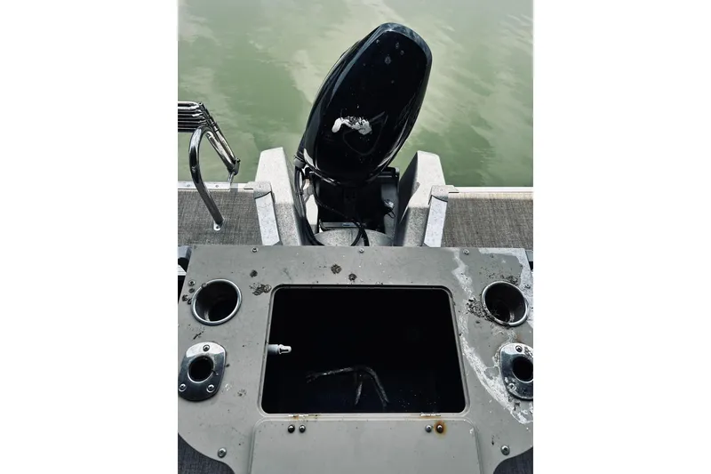 Slide: The Image of 2021 Avalon LSZ Rear Fish boat with motor and fishing rod holders. - 14