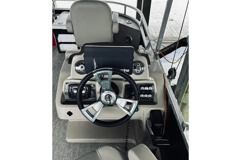 Slide: The Image of Steering console of 2021 Avalon LSZ Rear Fish 22' boat with modern controls. - 6
