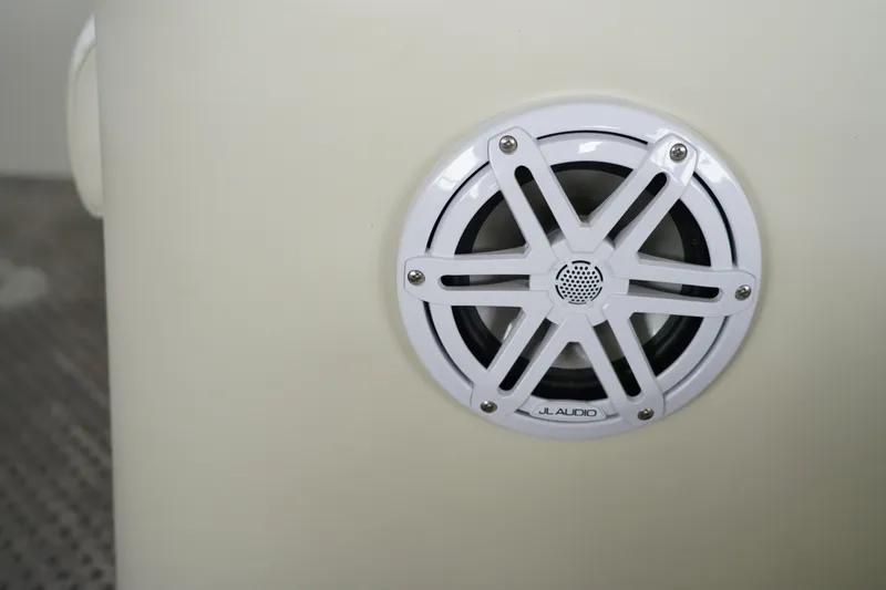 Slide: The Image of White JL Audio speaker on a 2005 Bennington II 207L boat interior. - 8