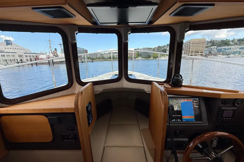 Slide: The Image of Interior view of 2014 Ranger Tugs R-27 boat cockpit with navigation equipment. - 31