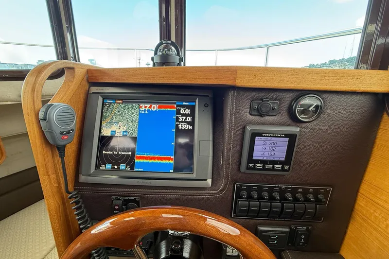 Slide: The Image of Dashboard of a 2014 Ranger Tugs R-27 with navigation and communication equipment. - 40