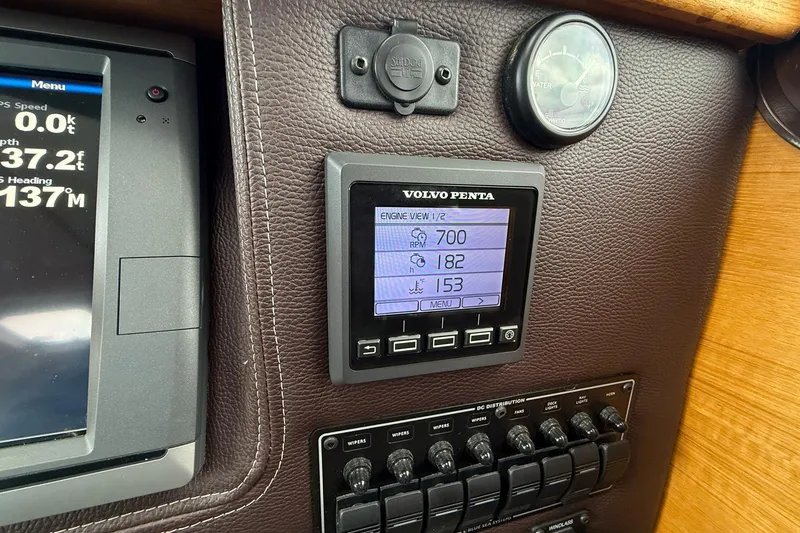 Slide: The Image of Volvo Penta engine display on 2014 Ranger Tugs R-27 dashboard, showing RPM and temperature. - 41