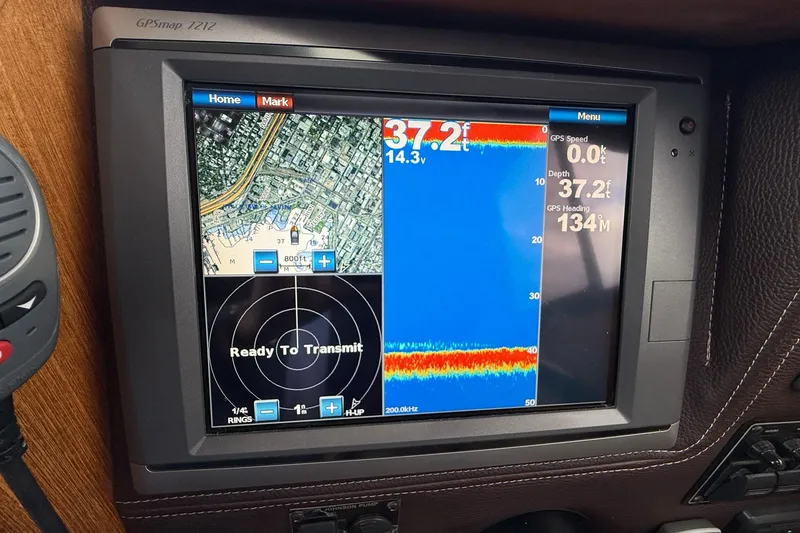 Slide: The Image of GPS navigation screen on a 2014 Ranger Tugs R-27 boat, displaying depth and map data. - 42
