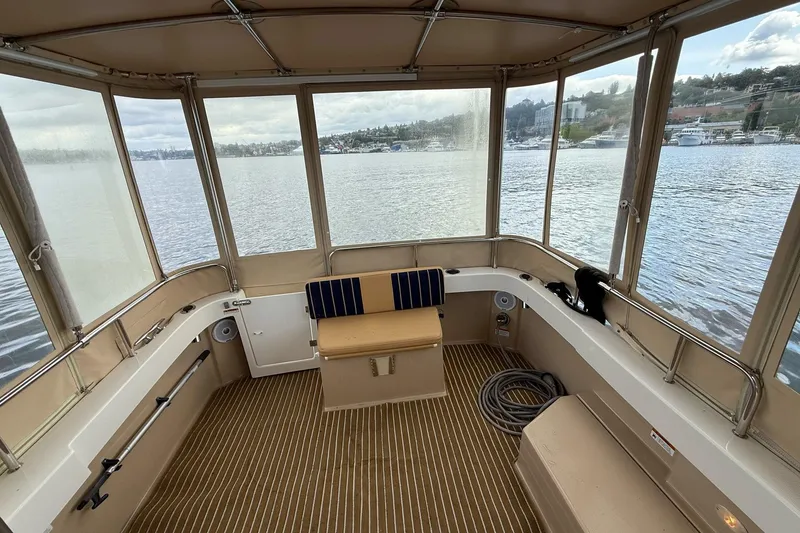Slide: The Image of 2014 Ranger Tugs R-27 boat interior with panoramic water view. - 58