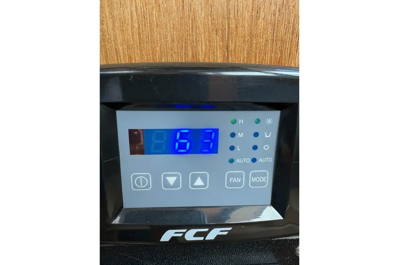 Slide: The Image of Digital control panel on a 2014 Ranger Tugs R-27 boat displaying temperature settings. - 68