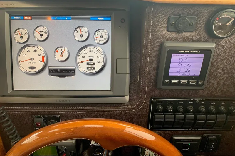 Slide: The Image of Dashboard of a 2014 Ranger Tugs R-27 with Garmin and Volvo Penta displays. - 9