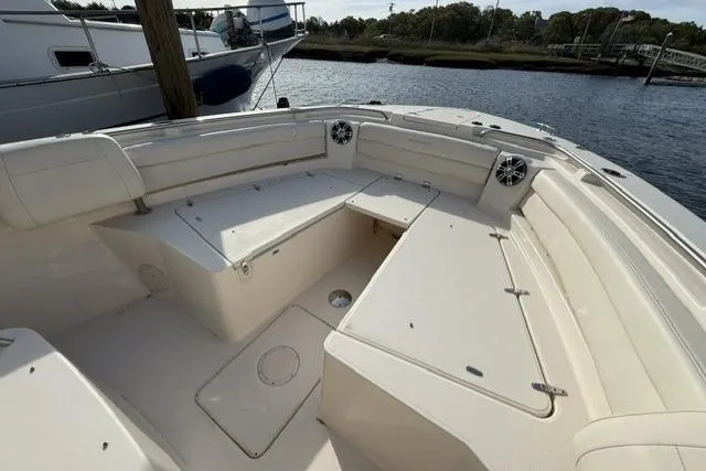 Slide: The Image of 2023 Grady-White Canyon 326 boat interior with spacious seating and storage compartments. - 13