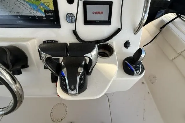 Slide: The Image of Control panel of 2023 Grady-White Canyon 326 boat with Yamaha throttle and navigation display. - 20