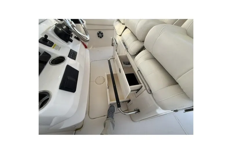 Slide: The Image of 2023 Grady-White Canyon 326 boat interior with storage drawer and seating. - 24