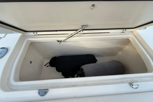 Slide: The Image of Open storage compartment on 2023 Grady-White Canyon 326 boat, showing interior space. - 30
